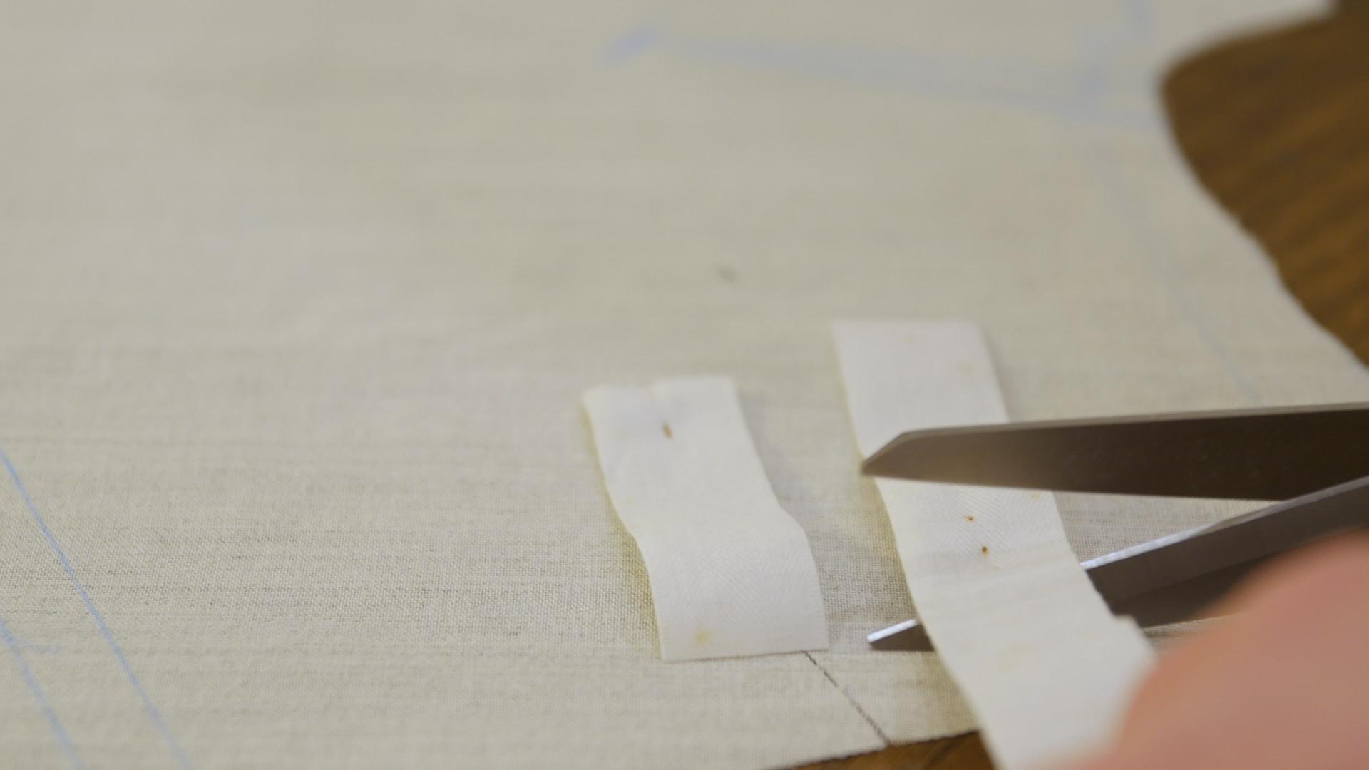 剪裁、剪裁、斜带、斜边装订是一条窄条织物剪裁带在斜边视频的预览图