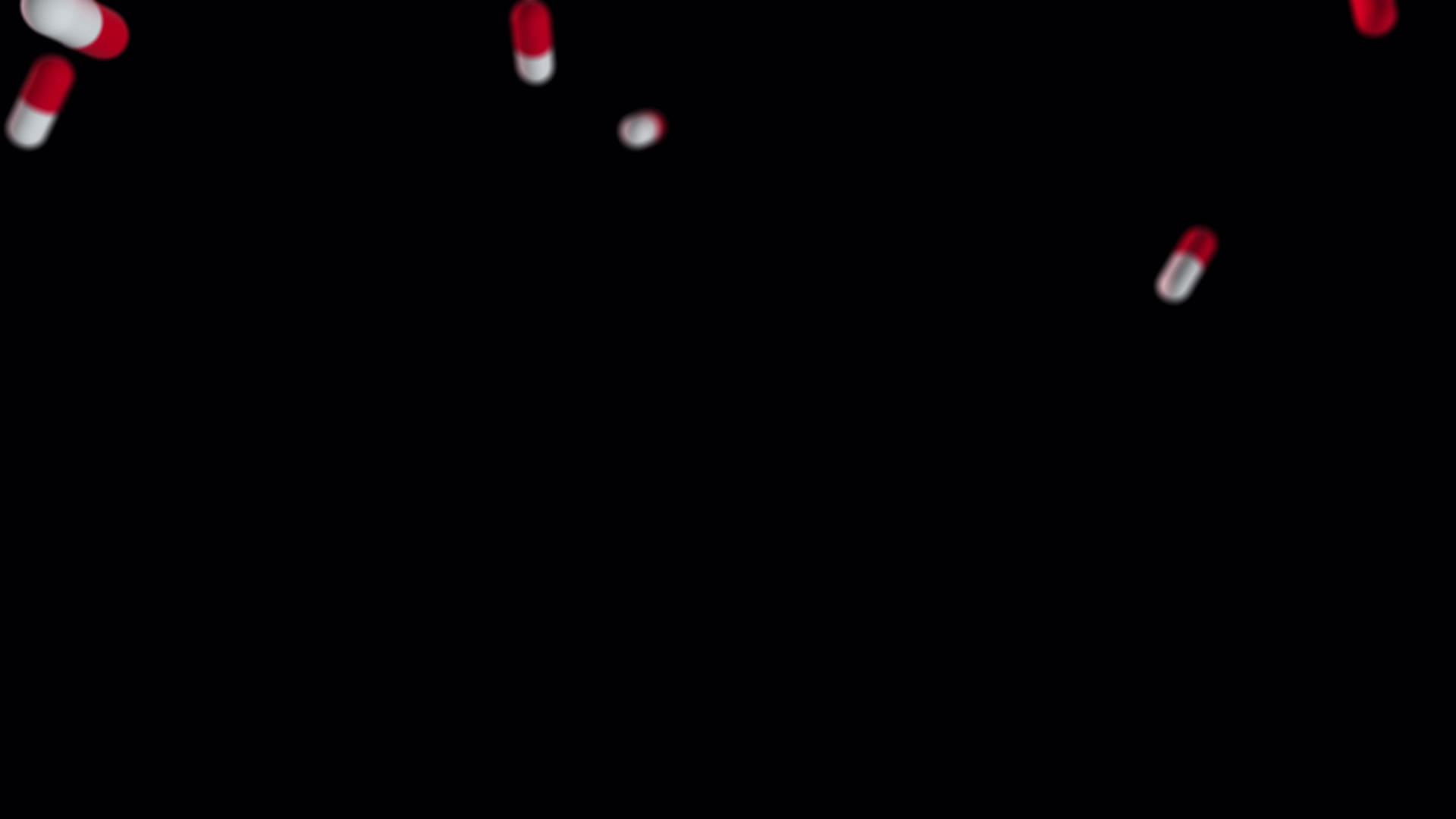 超慢动作的飞行红白药丸拍摄他们从上面掉下来视频的预览图