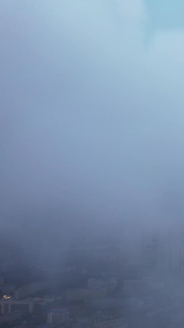 城市地标天际线商务中心高空航拍云雾中的高楼晚霞天空素材视频的预览图