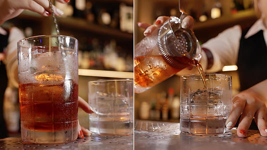 调酒师使用滤网将酒倒入酒杯视频的预览图