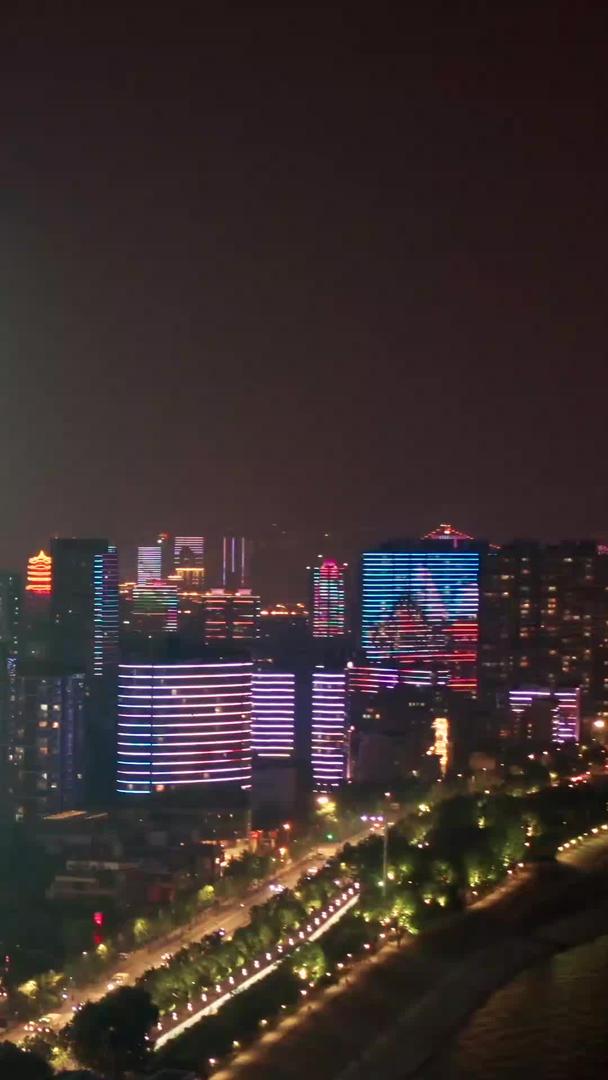 航拍江边建筑及城市灯光秀视频的预览图
