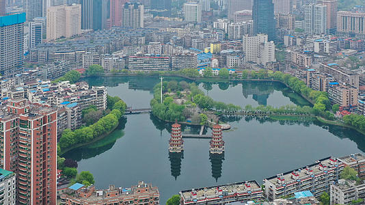 航拍武汉汉口宝岛公园湖景双塔视频的预览图