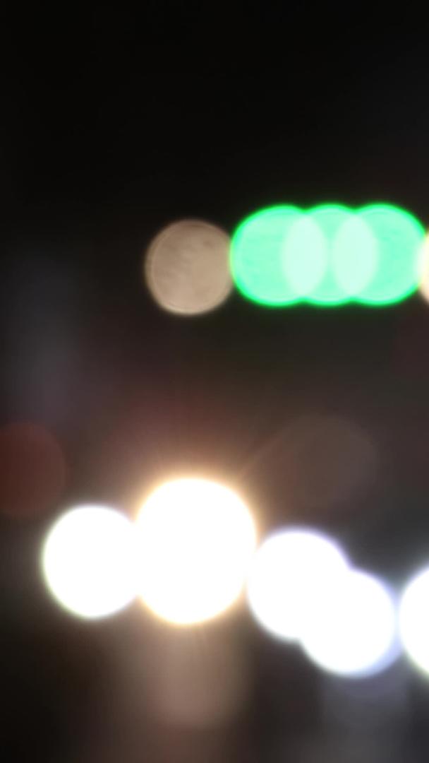 夜晚城市下班高峰期汽车灯晕多镜头组合实拍视频的预览图