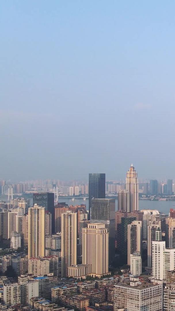武汉市中心中央商务区航拍风景城市蓝天白云下的标志性建筑写字楼材料视频的预览图