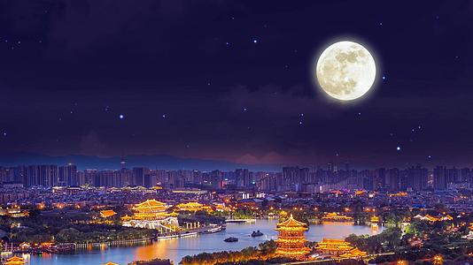 4K城市夜景城市月亮背景视频视频的预览图