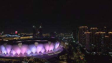 4K航拍杭州奥体中心莲花碗体育馆周边夜景视频的预览图