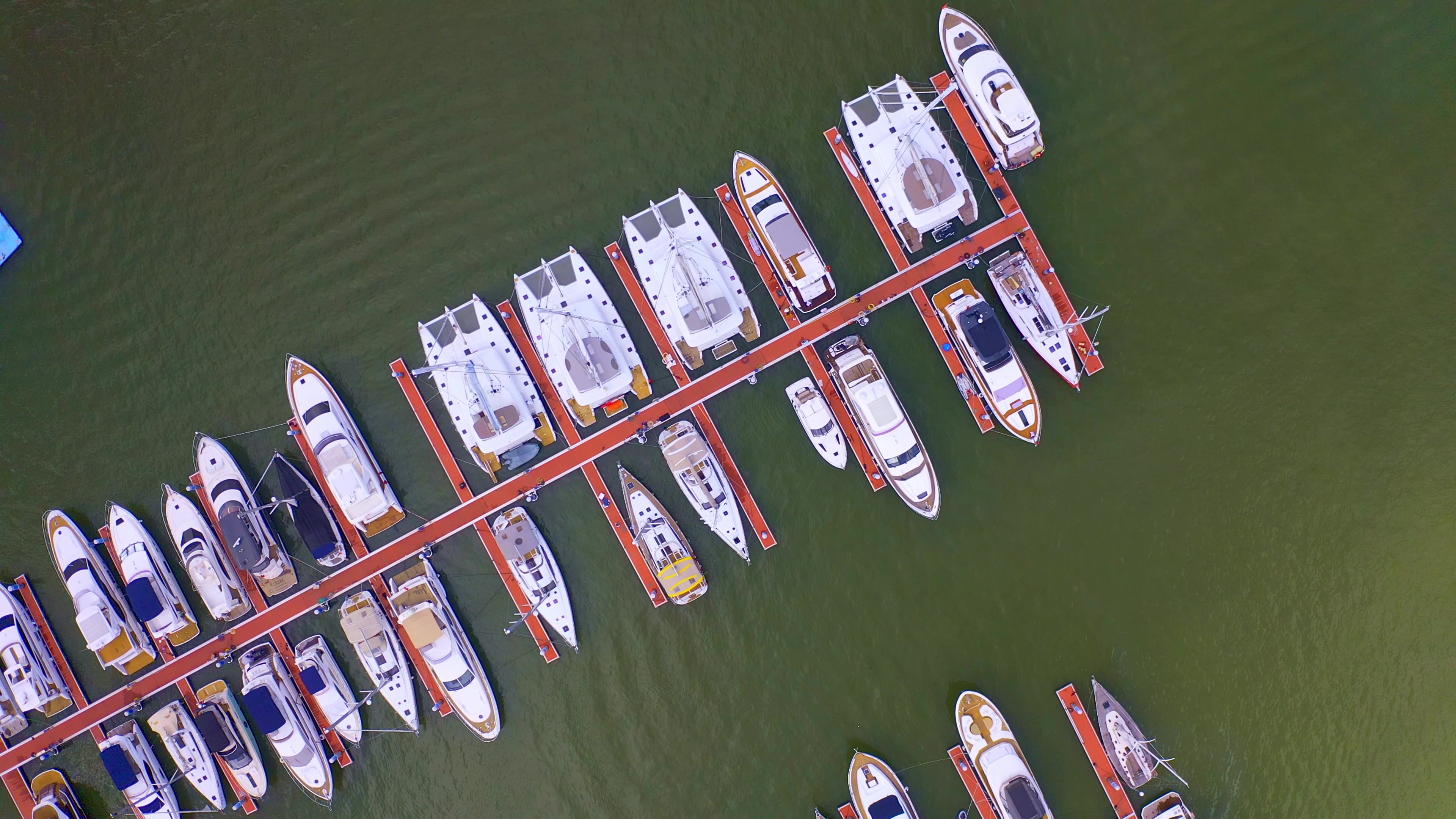 4K实拍船舶整齐停泊在海面上航拍视频素材视频的预览图