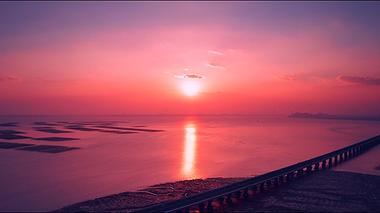 1080航拍跨海大桥边唯美夕阳晚霞素材视频的预览图