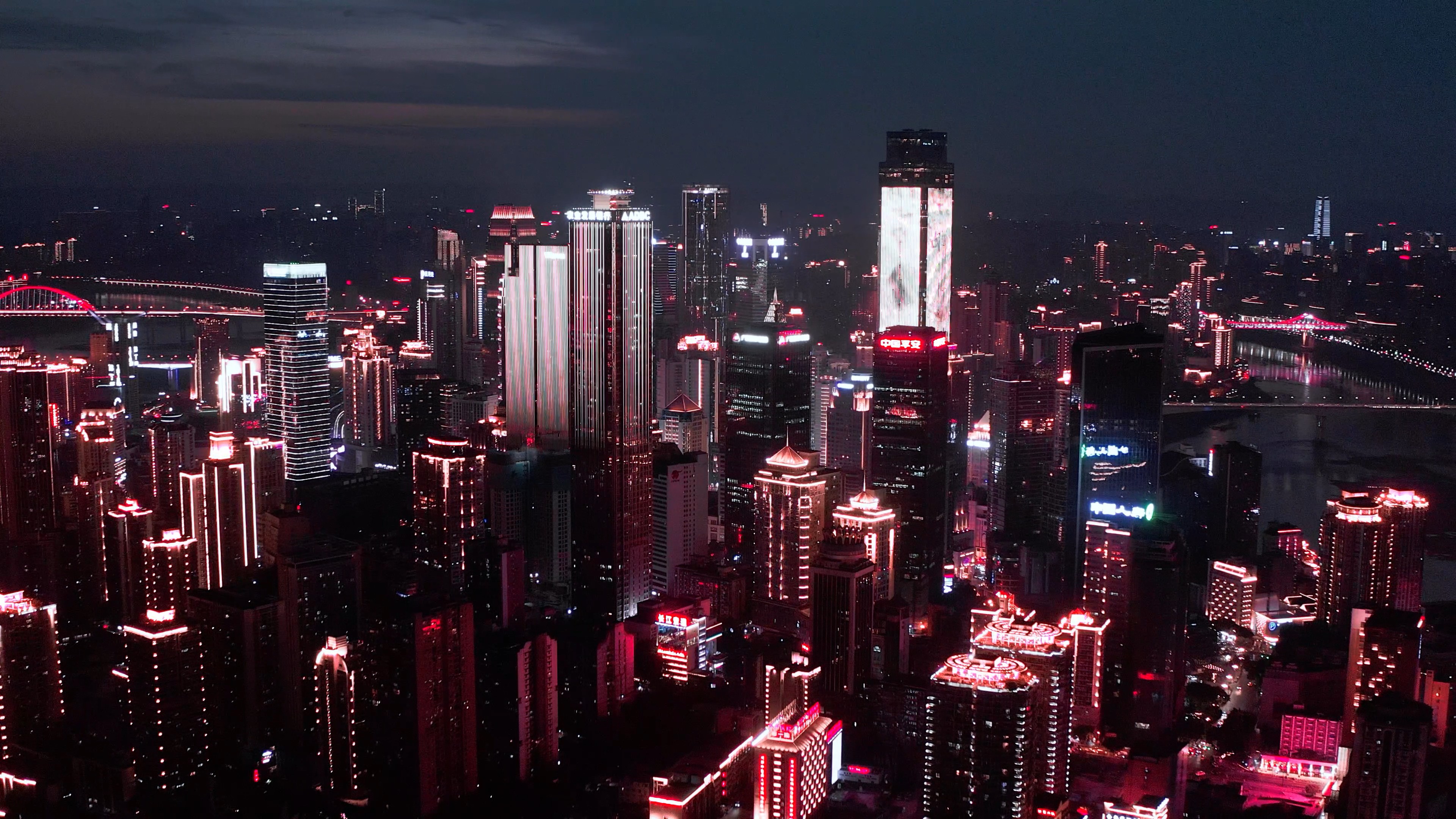 4k航拍猩红色重庆解放碑CBD建筑城市夜景灯光视频的预览图