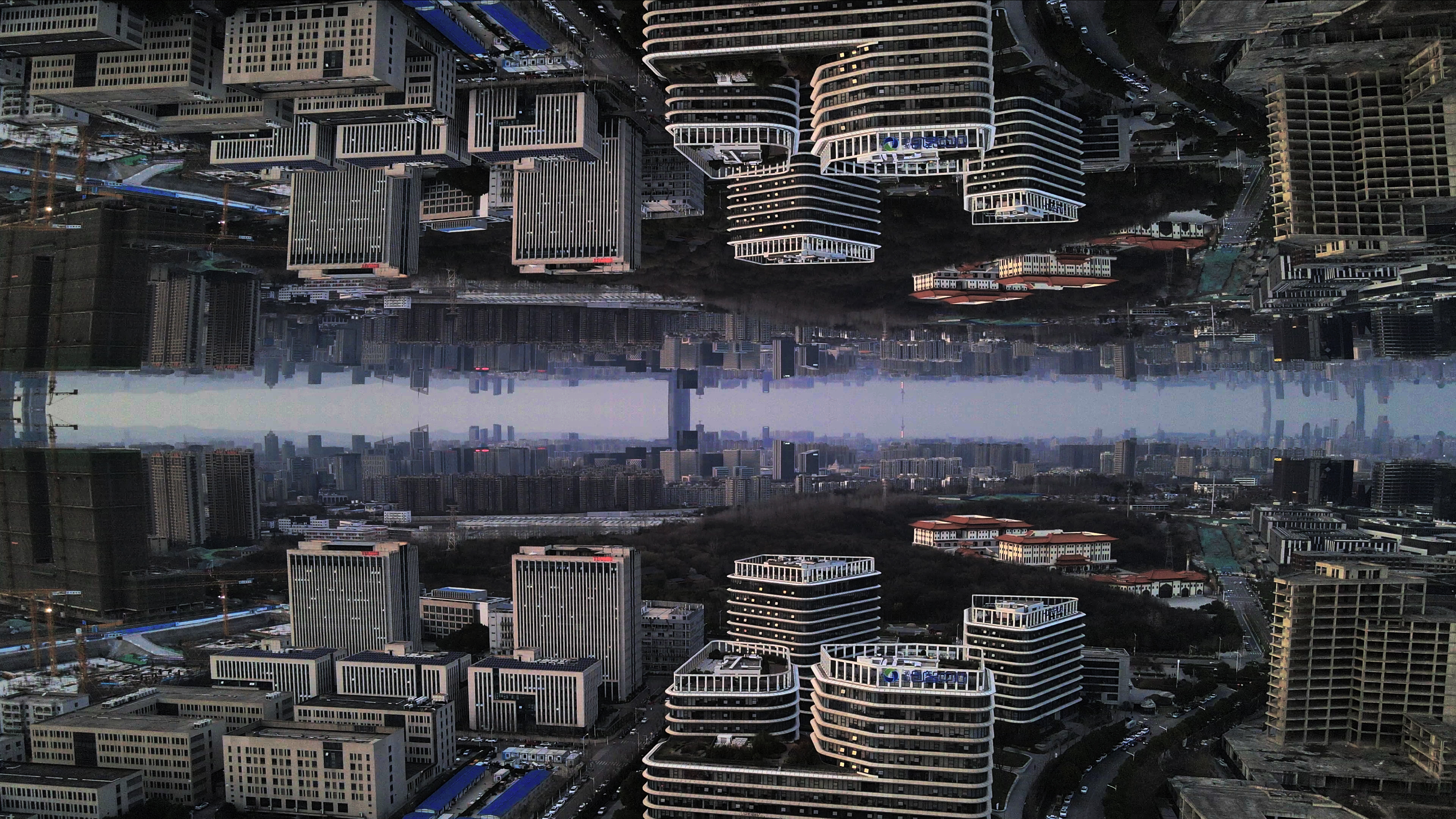 4K航拍南京楼房大厦城市倒影视频的预览图