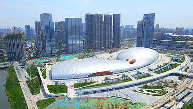 4K大气航拍杭州城市地标建筑奥体中心游泳馆一角视频的预览图