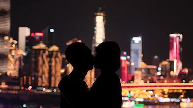 4k唯美城市灯光下情侣浪漫亲吻剪影七夕爱情意境视频的预览图