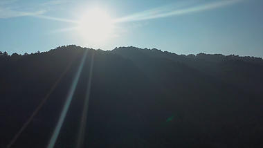 4k航拍阳光透过山间耶稣光丁达尔光线视频的预览图