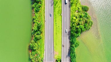 4k航拍汽车行驶跨河交通大道视频的预览图