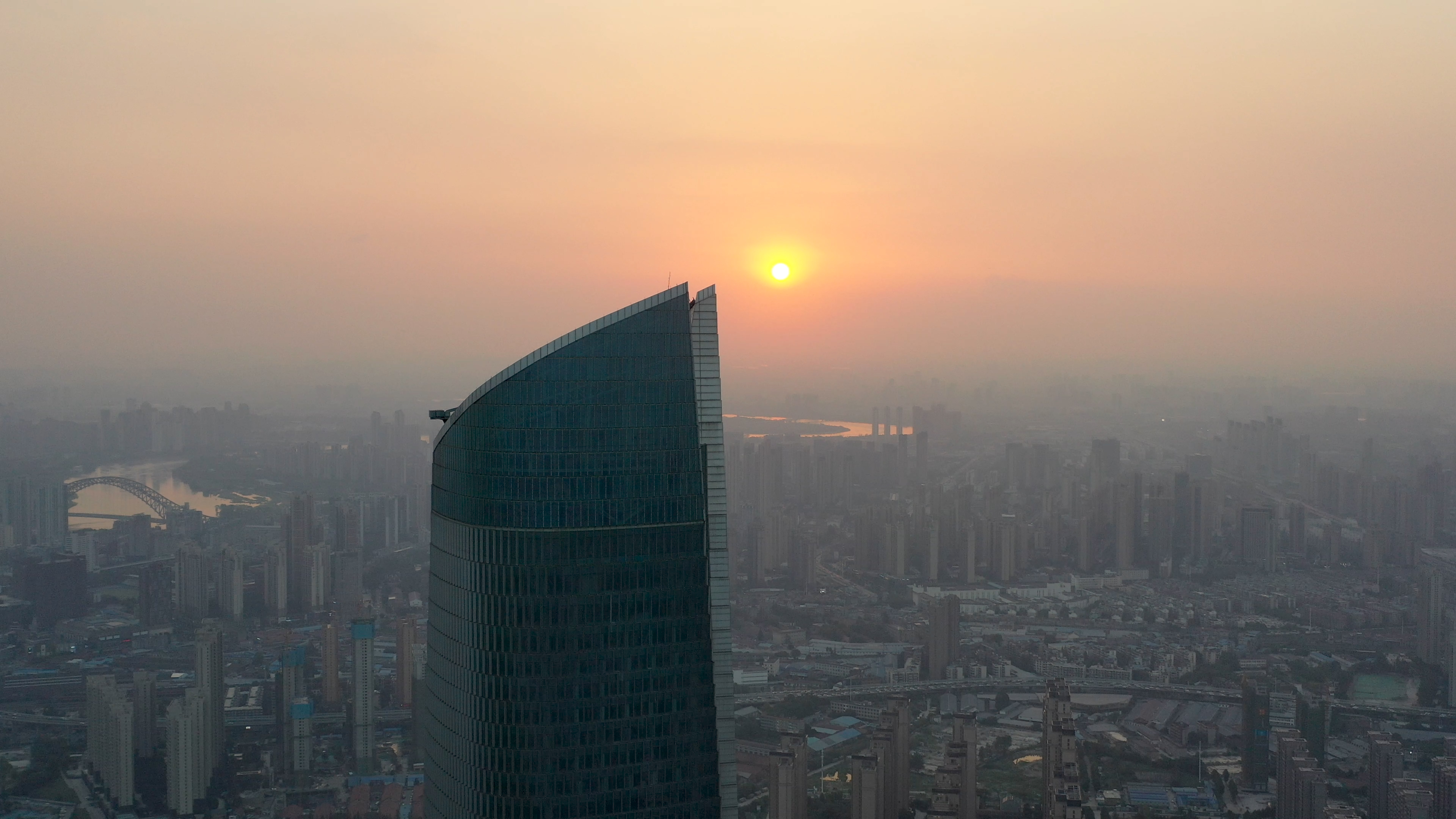 4K武汉城市建筑商务楼航拍日落实拍视频视频的预览图